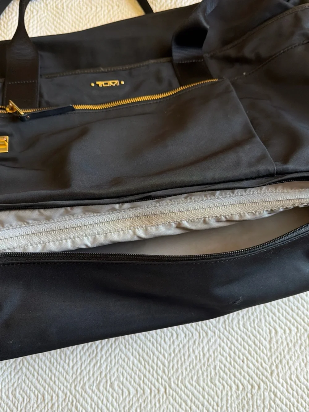 Tumi Black Duffel Bag with Gold Hardware